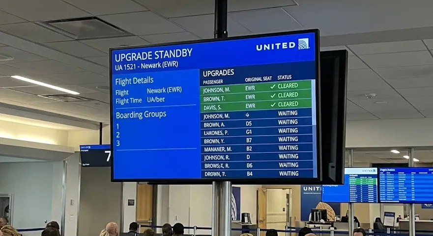 A screenshot of the United Airlines mobile app showing the dynamic passenger upgrade waitlist and priority ranking
