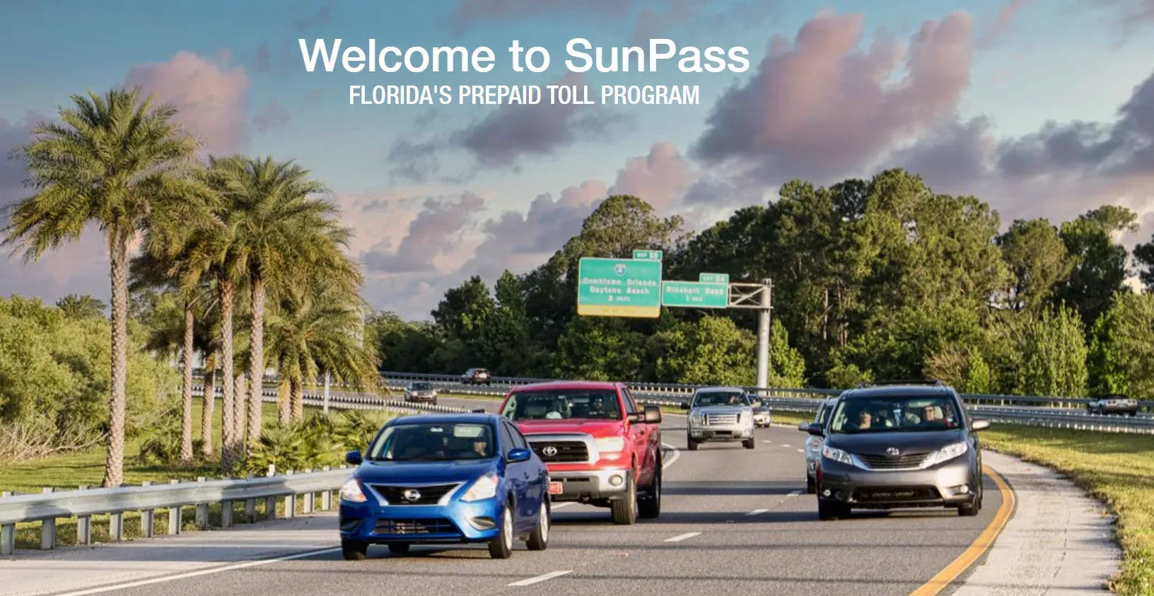 Cars driving under an electronic All-Electronic Tolling gantry on the Florida Turnpike without stopping