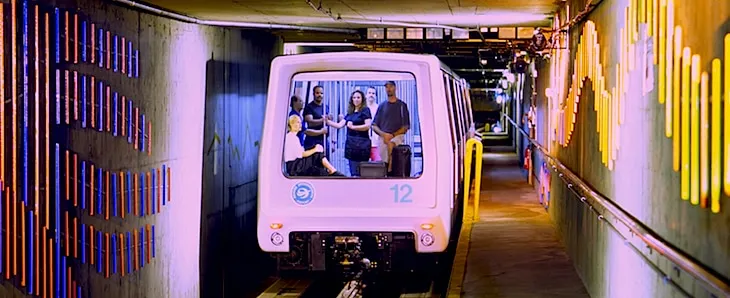 Passengers boarding the Automated Guideway Transit System underground train at DEN airport to connect to Concourses B and C