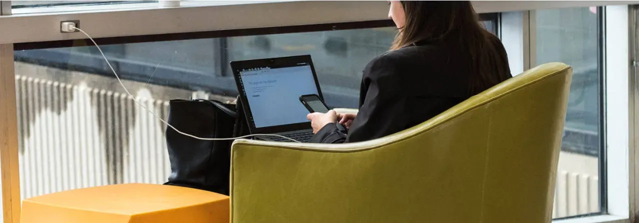 Passenger using a smartphone on free airport WiFi at Philadelphia International Airport