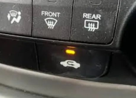 Close up of a car dashboard showing the AC recirculation button activated to keep out wildfire smoke