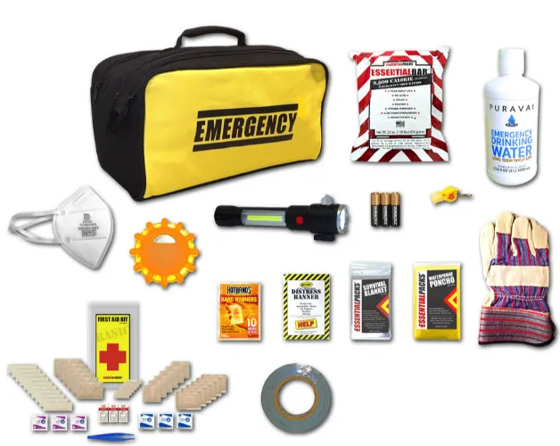A well packed car emergency survival kit in a trunk featuring a portable power station, traction boards, and N95 masks