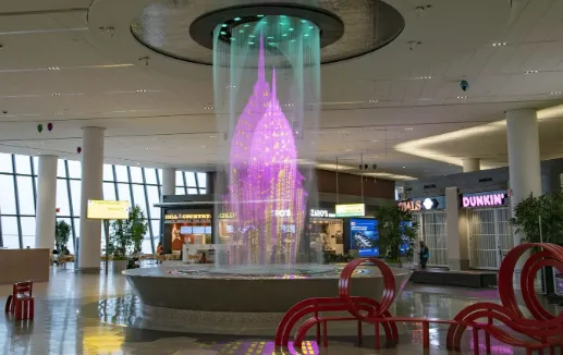 The newly renovated Terminal B at LaGuardia Airport featuring the stunning water feature and modern architecture