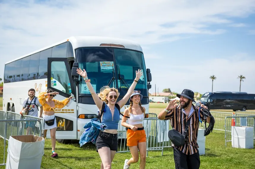 Official Valley Music Travel Any Line Shuttle buses lined up at the Coachella transportation hub