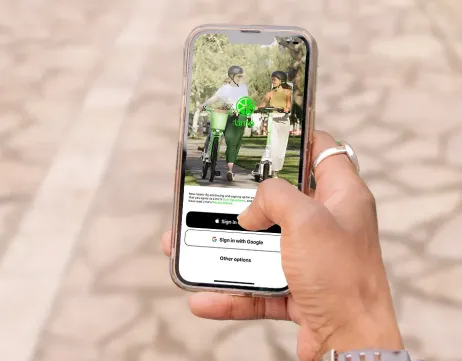 Unlock a green Lime e-scooter using the Uber app interface